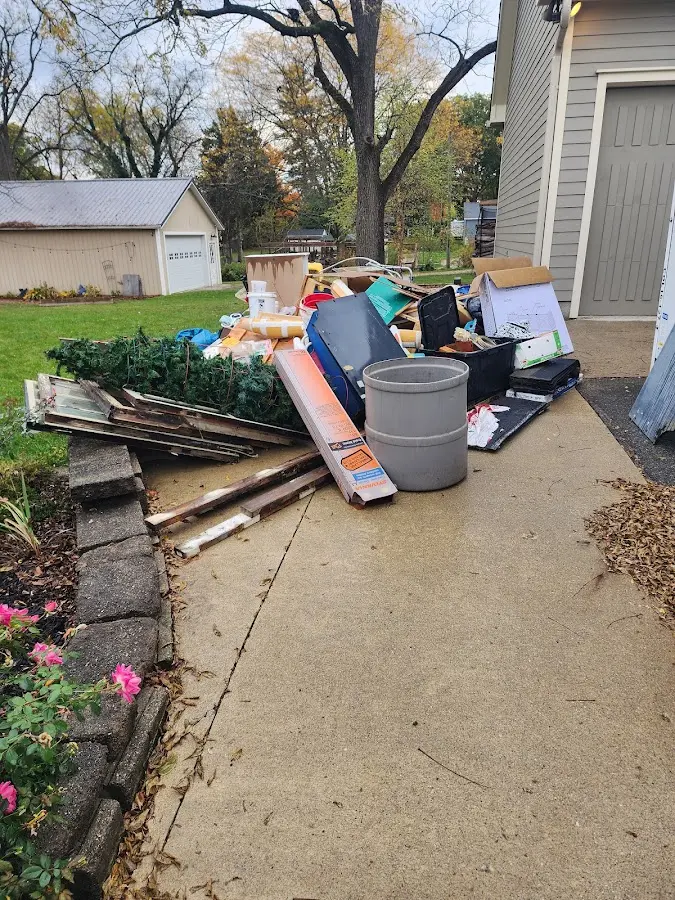 Dumpster being loaded with debris for 10 Yard Dumpster Rental in Delran